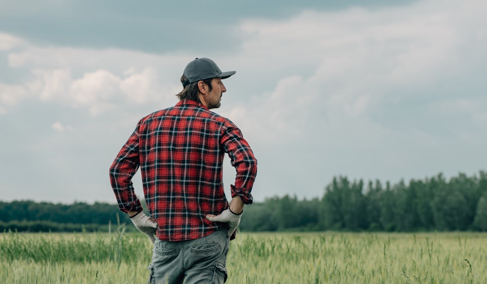 A farmer stood in a field.